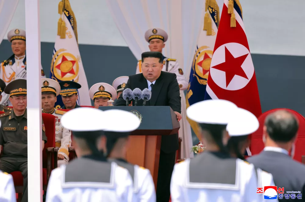 In this photo provided Wednesday, June 24, 2026, by the North Korean government, its leader Kim Jong Un, center, speaks during a commissioning ceremony of its destroyer Choe Hyon at the port in Nampo Tuesday, June 23, 2026. Independent journalists were not given access to cover the event depicted in this image distributed by the North Korean government. The content of this image is as provided and cannot be independently verified. Korean language watermark on image as provided by source reads: "KCNA" which is the abbreviation for Korean Central News Agency. (Korean Central News Agency/Korea News Service via AP)