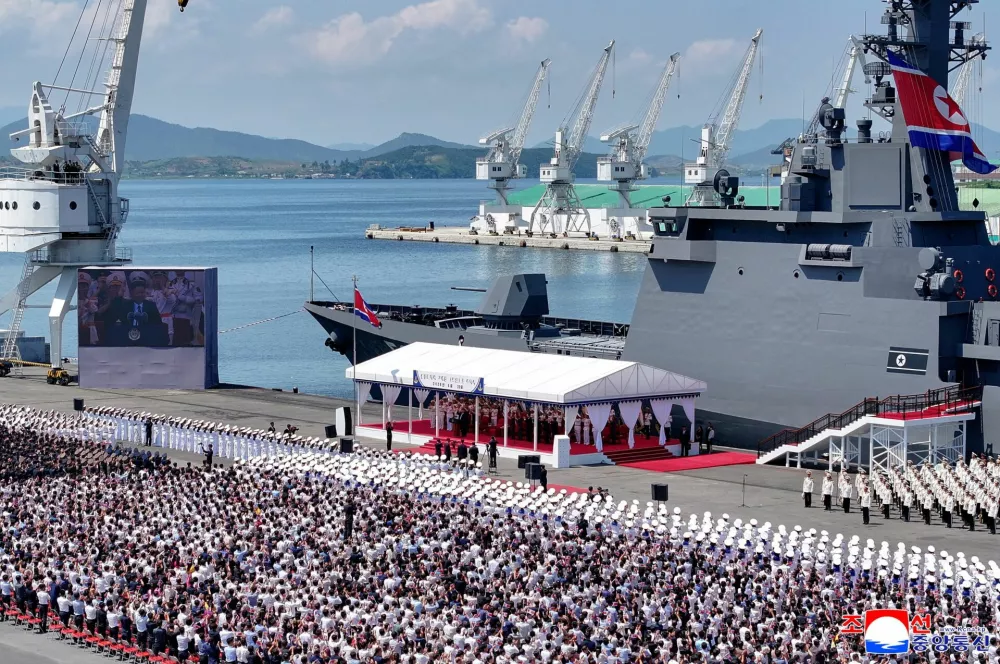 A screen shows North Korean leader Kim Jong Un speaking during the commissioning ceremony of the new multipurpose destroyer Choe Hyon at Nampho port, North Korea, June 23, 2026, in this picture released by North Korea's official Korean Central News Agency.  KCNA via REUTERS  ATTENTION EDITORS - THIS IMAGE WAS PROVIDED BY A THIRD PARTY. REUTERS IS UNABLE TO INDEPENDENTLY VERIFY THIS IMAGE. NO THIRD PARTY SALES. SOUTH KOREA OUT. NO COMMERCIAL OR EDITORIAL SALES IN SOUTH KOREA.