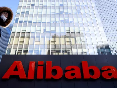 FILE PHOTO: FILE PHOTO: The logo of Alibaba Group is seen at its office in Beijing, China January 5, 2021. REUTERS/Thomas Peter/File Photo/File Photo/File Photo