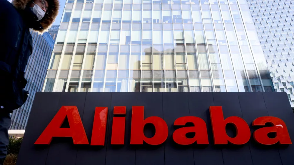 FILE PHOTO: FILE PHOTO: The logo of Alibaba Group is seen at its office in Beijing, China January 5, 2021. REUTERS/Thomas Peter/File Photo/File Photo/File Photo