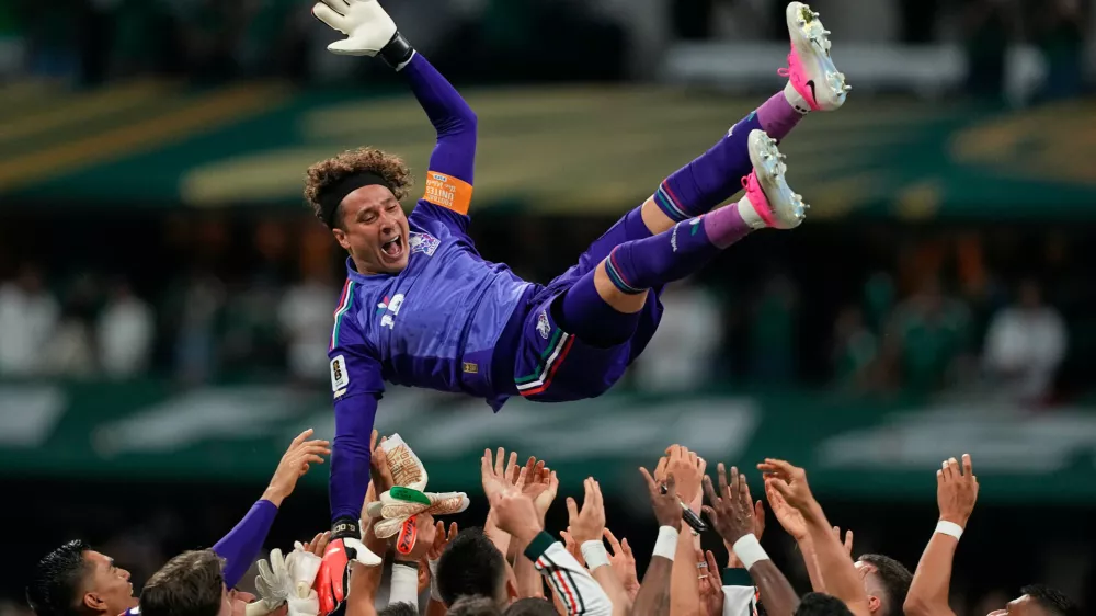 Mexico goalkeeper Guillermo Ochoa (13) is celebrated by his team after the World Cup Group A soccer match between Czechia and Mexico in Mexico City, Wednesday, June 24, 2026. (AP Photo/Natacha Pisarenko)