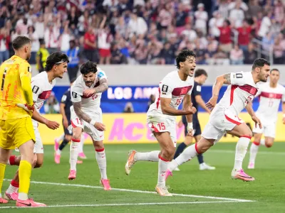 Turkey's Kaan Ayhan, right, celebrates scoring his side's third goal against the United States during a World Cup Group D soccer match in Inglewood, Calif., near Los Angeles, Thursday, June 25, 2026. (AP Photo/Mark J. Terrill)