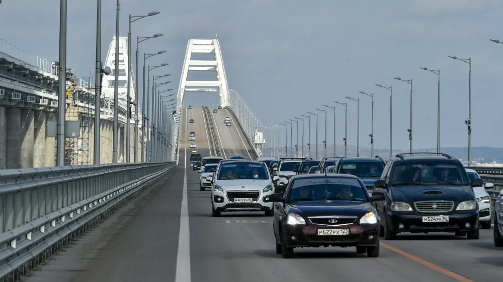 FILE - Cars and other vehicles drive on the Kerch&nbsp;Bridge connecting the Russian mainland and the Crimean&nbsp;Peninsula on&nbsp;Thursday, Feb. 23, 2023. &nbsp;(AP Photo, File)