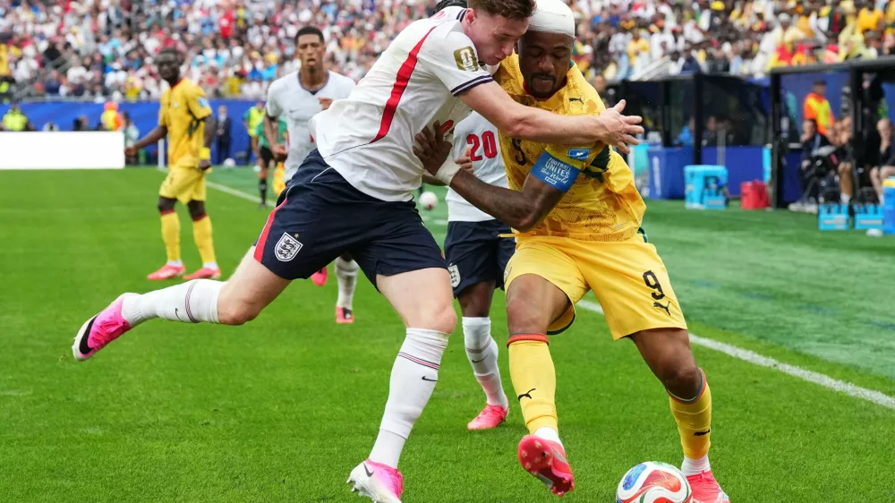 Ghana's Kwasi Sibo (8), right, fights for the ball with England's Elliot Anderson (8) during the World Cup Group L soccer match between England and Ghana in Foxborough, Mass., near Boston, Tuesday, June 23, 2026. (AP Photo/Martin Meissner)