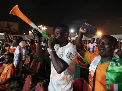 Soccer Football - FIFA World Cup 2026 - Group E - Curacao v Ivory Coast - Fans gather in Abidjan - Abidjan, Ivory Coast - June 25, 2026 Ivory Coast fans celebrate after the match as Ivory Coast qualify for the knockout stages of the World Cup REUTERS/Luc Gnago