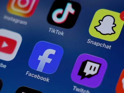 FILE PHOTO: Instagram, TikTok, Snapchat, YouTube, Facebook, Twitch and Reddit applications are displayed on a mobile phone in this picture illustration taken on December 9, 2025. REUTERS/Hollie Adams/Illustration/File Photo