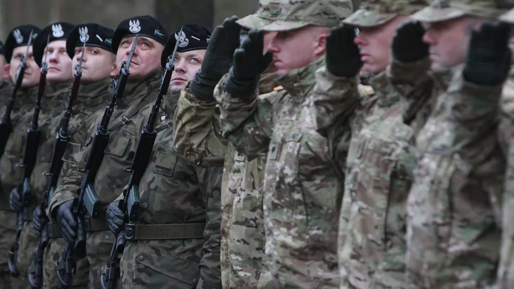 In this file photo taken Jan. 12, 2017, U.S. Army vehicles are crossing the Polish border in Olszyna, Poland, heading for their new base in Zagan. U.S. troops deployed to Zagan in western Poland in 2017 as part of deterrence force of some 1,000 troops to reassure Poland that is worried about Russia's activity.(AP Photo/Czarek Sokolowski)