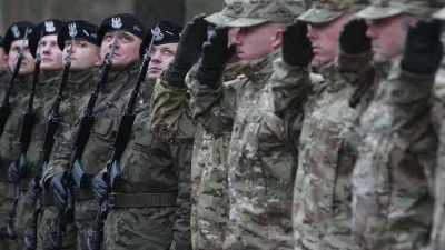 In this file photo taken Jan. 12, 2017, U.S. Army vehicles are crossing the Polish border in Olszyna, Poland, heading for their new base in Zagan. U.S. troops deployed to Zagan in western Poland in 2017 as part of deterrence force of some 1,000 troops to reassure Poland that is worried about Russia's activity.(AP Photo/Czarek Sokolowski)