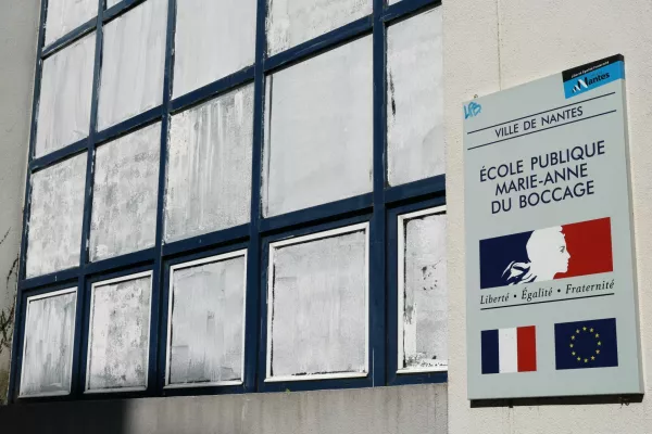 View of the windows coated in Blanc de Meudon, a chalk-based powder applied by parents to protect their children from the heat at the public school Marie-Anne du Boccage in Nantes, during a heatwave affecting a majority of the country, France, June 25, 2026. REUTERS/Stephane Mahe