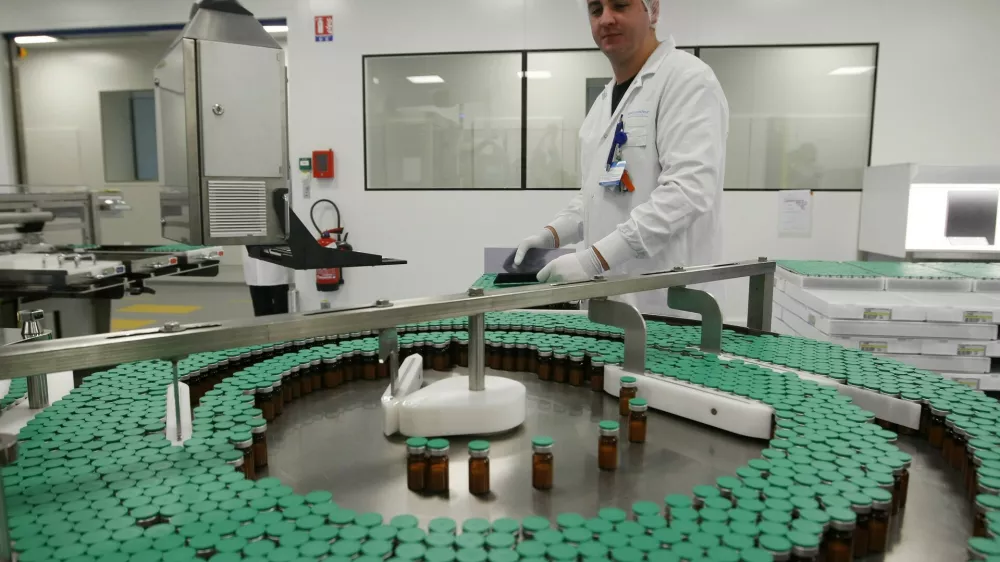 A laboratory technician is seen at a Sanofi-Pasteur production plant manufacturing Panenza, a vaccine for the H1N1 flu virus, in Val-de-Reuil, western Paris, Monday, Oct. 19, 2009. France will begin vaccinating key medical workers against swine flu on Tuesday, Oct. 20, 2009. (AP Photo/Jacques Brinon)