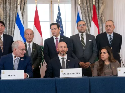 Secretary of State Marco Rubio watches as Israel's Ambassador to the U.S. Yechiel Leiter, seated at left, looks to Lebanon's Ambassador to the U.S. Nada Hamadeh, seated at right, while speaking at a signing of a framework agreement, described as a first step toward peace following months of conflict between Israel and the Lebanese militant group Hezbollah, at the State Department, Friday, June 26, 2026, in Washington. (AP Photo/Kevin Wolf)