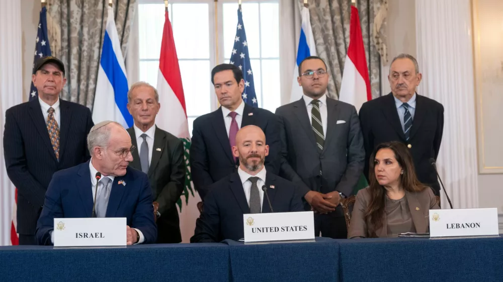 Secretary of State Marco Rubio watches as Israel's Ambassador to the U.S. Yechiel Leiter, seated at left, looks to Lebanon's Ambassador to the U.S. Nada Hamadeh, seated at right, while speaking at a signing of a framework agreement, described as a first step toward peace following months of conflict between Israel and the Lebanese militant group Hezbollah, at the State Department, Friday, June 26, 2026, in Washington. (AP Photo/Kevin Wolf)