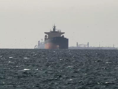 FILE PHOTO: FILE PHOTO: Cargo ships in the Gulf, near the Strait of Hormuz, as seen from northern Ras al-Khaimah, near the border with Oman's Musandam governance, amid the U.S.-Israeli conflict with Iran, in United Arab Emirates, March 11, 2026. REUTERS/Stringer/File Photo