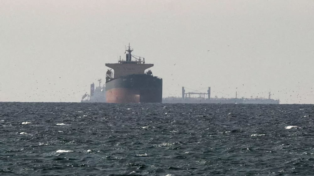 FILE PHOTO: FILE PHOTO: Cargo ships in the Gulf, near the Strait of Hormuz, as seen from northern Ras al-Khaimah, near the border with Oman's Musandam governance, amid the U.S.-Israeli conflict with Iran, in United Arab Emirates, March 11, 2026. REUTERS/Stringer/File Photo