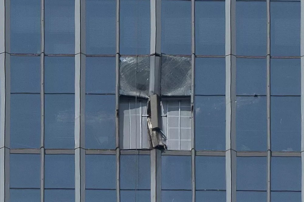 A section damaged after a small plane crashed into it is boarded up at the CITIC Tower, also known as China Zun, the tallest building in Beijing, on Saturday, June 27, 2026. (AP Photo/Ng Han Guan)