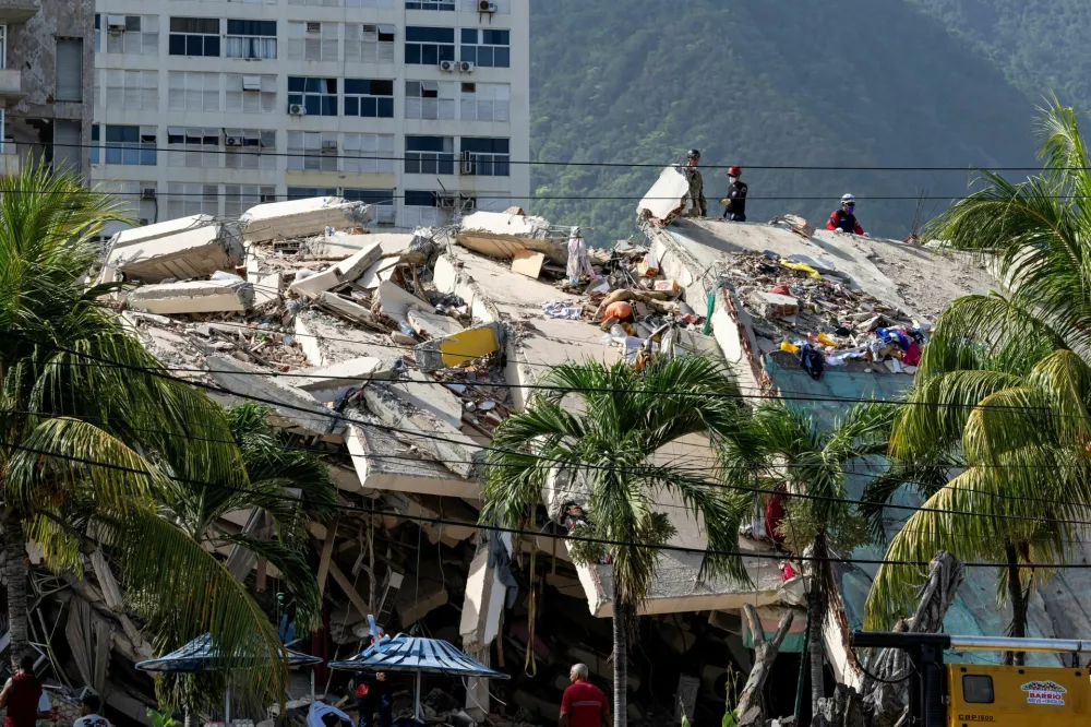 A damaged building is seen from the base camp of the French Civil Security Training and Intervention Regiment (UIISC 7) at the Karting La Guaira complex in Caraballeda, La Guaira state, Venezuela, on June 27, 2026, as they assist with rescue operations following earthquakes. MIGUEL MEDINA/Pool via REUTERS