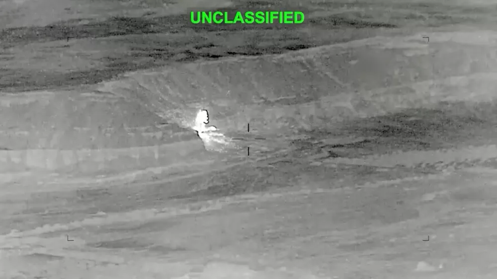 A drone footage shows fire and smoke rising, after what the U.S. Central Command said, were strikes on Iran targeting various sites in response to continued Iranian aggression against commercial shipping, at an unknown location in this screengrab from a hadout video released on June 27, 2026. U.S. Central Command/Handout via REUTERS. THIS IMAGE HAS BEEN SUPPLIED BY A THIRD PARTY. MANDATORY CREDIT. TEXT OVERLAY FROM SOURCE. VERIFICATION: - Location and date could not be verified - No earlier version of the video found posted online before Saturday, June 27