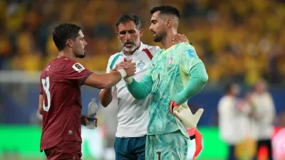 Portugal goalkeeper Diogo Costa (1) greets Pedro Neto after the World Cup Group K soccer match between Colombia and Portugal in Miami Gardens, Fla., Saturday, June 27, 2026. (AP Photo/Lynne Sladky)