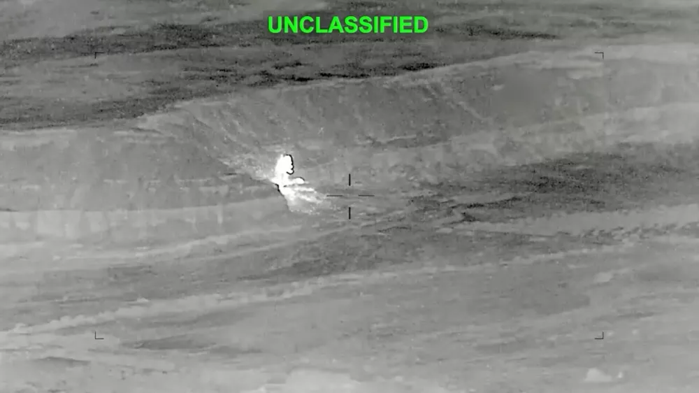 A drone footage shows fire and smoke rising, after what the U.S. Central Command said, were strikes on Iran targeting various sites in response to continued Iranian aggression against commercial shipping, at an unknown location in this screengrab from a hadout video released on June 27, 2026. U.S. Central Command/Handout via REUTERS. THIS IMAGE HAS BEEN SUPPLIED BY A THIRD PARTY. MANDATORY CREDIT. TEXT OVERLAY FROM SOURCE. VERIFICATION: - Location and date could not be verified - No earlier version of the video found posted online before Saturday, June 27