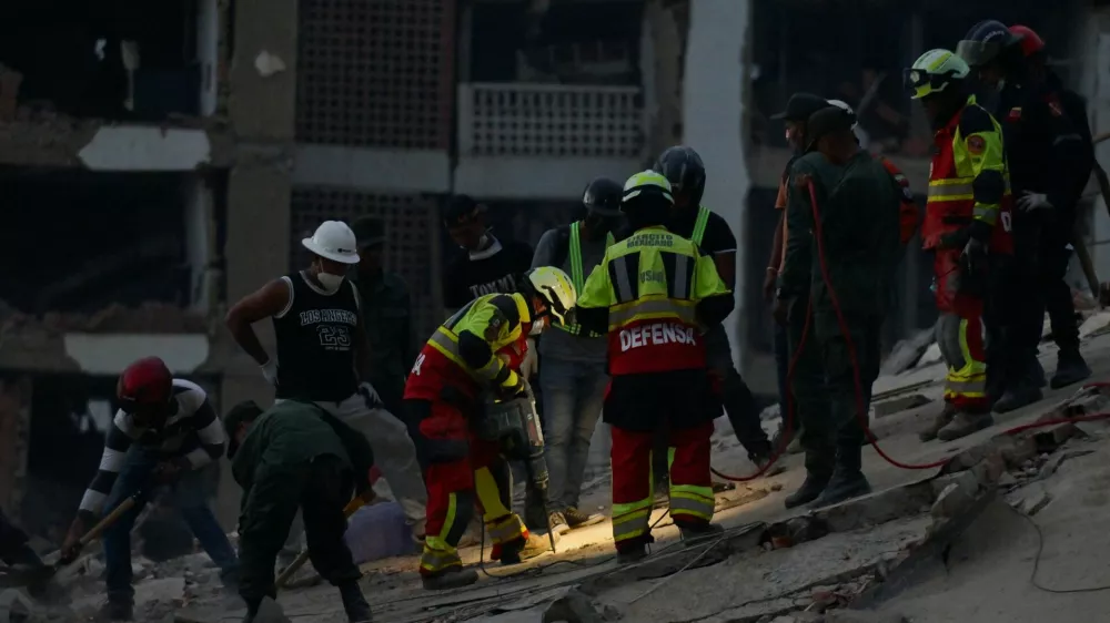 Rescue personnel assist in rescue efforts after earthquakes hit the country, in La Guaira, Venezuela, June 27, 2026. REUTERS/Maxwell Briceno