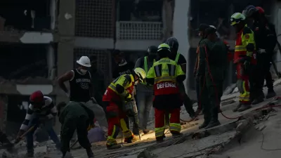 Rescue personnel assist in rescue efforts after earthquakes hit the country, in La Guaira, Venezuela, June 27, 2026. REUTERS/Maxwell Briceno