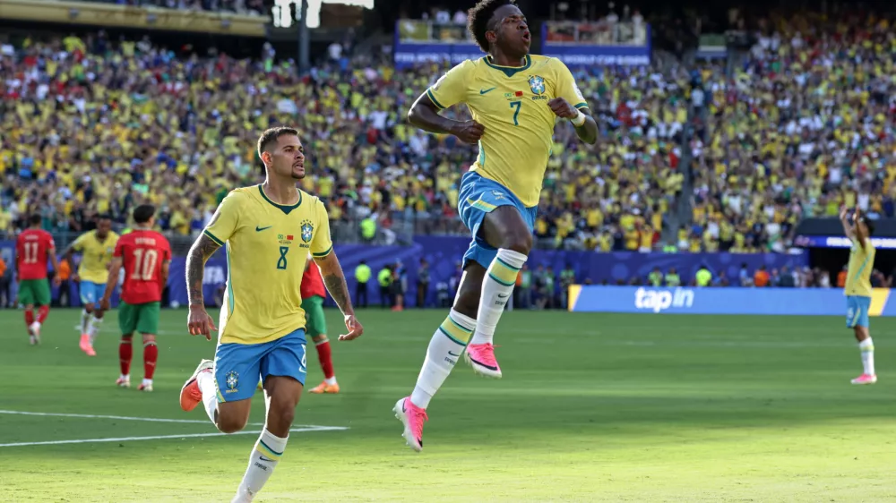Brazil's Vinicius Junior (7) celebrates with teammate Bruno Guimaraes (8) after scoring during the World Cup Group C soccer match against Morocco in East Rutherford, N.J., near New York, Saturday, June 13, 2026. (AP Photo/Matt Slocum)