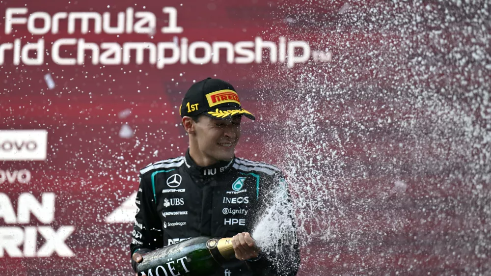 Mercedes driver George Russell of Britain celebrates on the podium after winning the Austrian F1 Grand Prix, in Spielberg, Austria, Sunday, June 28, 2026. (AP Photo/Denes Erdos)