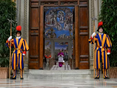 Swiss guards stand at the Sistine Chapel, ahead of the conclave to elect the next pope at the Vatican, May 7, 2025. Vatican Media/Handout via REUTERS  THIS IMAGE HAS BEEN SUPPLIED BY A THIRD PARTY