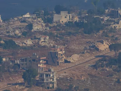 An Israeli flag, center, on a destroyed building in southern Lebanon is seen from northern Israel, on Sunday, June 28, 2026. (AP Photo/Ohad Zwigenberg) ADDITION: This adds the date.