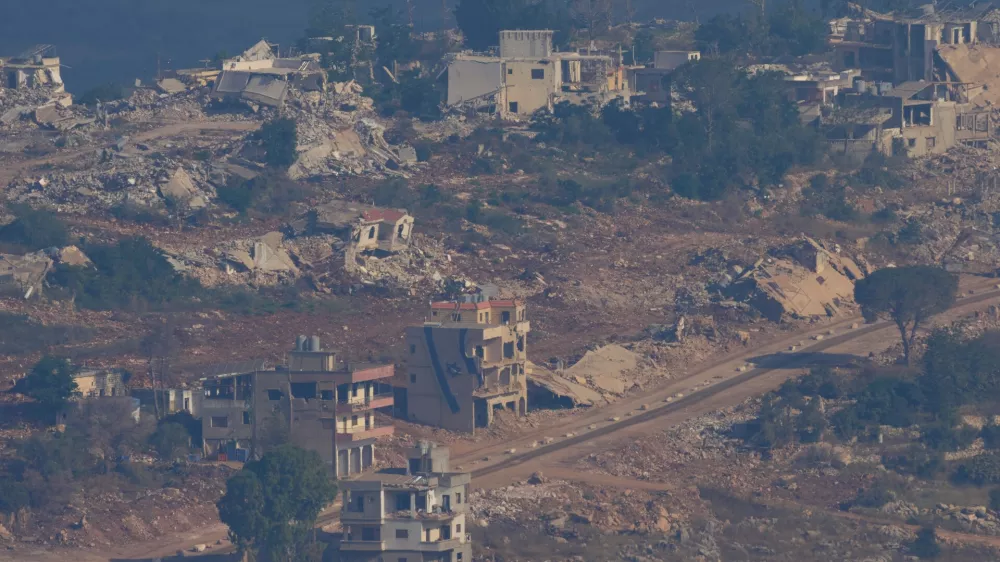 An Israeli flag, center, on a destroyed building in southern Lebanon is seen from northern Israel, on Sunday, June 28, 2026. (AP Photo/Ohad Zwigenberg) ADDITION: This adds the date.