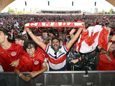 Soccer Football - FIFA World Cup 2026 - Round of 32 - South Africa v Canada - Fans gather in Vancouver - Vancouver, Canada - June 28, 2026 Canada fans celebrate at the Vancouver fan festival after Stephen Eustaquio scores their first goal REUTERS/Jennifer Gauthier
