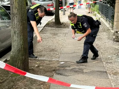 Police officers secure evidence at the scene of a shooting at Berlin's Steglitz district, Germany, June 27, 2026. Picture taken with a phone. REUTERS/Fabrizio Bensch