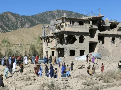 Residents and Taliban members gather near a destroyed building following an airstrike carried out by Pakistan's security forces, in Samkani District, Paktia Province, Afghanistan, June 29, 2026. REUTERS/Stringer