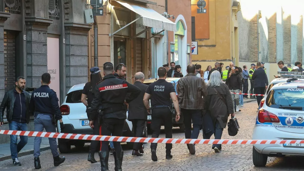 Police officers work at the scene after several people were injured when a car drove into pedestrians in the center of the northern Italian city of Modena, Italy, May 16, 2026. REUTERS/Stringer