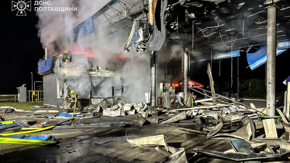 In this photo provided by the Ukrainian Emergency Services on Monday, June 29, 2026, a rescue worker puts out a fire of petrol station damaged by a Russian strike on Poltava region, Ukraine. (Ukrainian Emergency Service via AP)