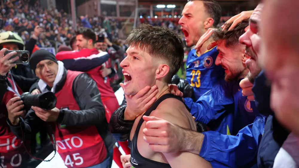 Bosnia's Esmir Bajraktarevic celebrates after winning a penalty shootout during the World Cup qualifying playoff final soccer match between Bosnia and Italy in Zenica, Bosnia, Tuesday, March 31, 2026. (AP Photo/Armin Durgut)