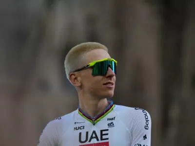 UAE Team Emirates's Tadej Pogacar looks on during a team presentation ahead of the Tour de France Cycling race, in front of the Basilica of the Sagrada Familia, in Barcelona, Spain, Thursday, July 2, 2026. (AP Photo/Mosa'ab Elshamy)