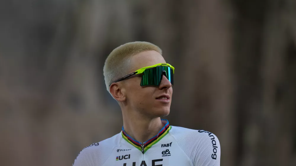 UAE Team Emirates's Tadej Pogacar looks on during a team presentation ahead of the Tour de France Cycling race, in front of the Basilica of the Sagrada Familia, in Barcelona, Spain, Thursday, July 2, 2026. (AP Photo/Mosa'ab Elshamy)