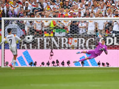 Paraguay goalkeeper Orlando Gill (12) blocks a shot by Germany's Kai Havertz (7) in a shootout during the World Cup round of 32 soccer match in Foxborough, Mass., near Boston, Monday, June 29, 2026. (AP Photo/Steven Senne)