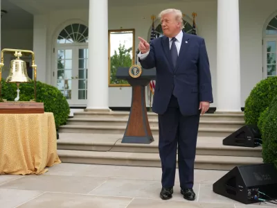 President Donald Trump speaks alongside the New York Stock Exchange bell in the White House Rose Garden, Monday, July 6, 2026, in Washington. (AP Photo/Julia Demaree Nikhinson)