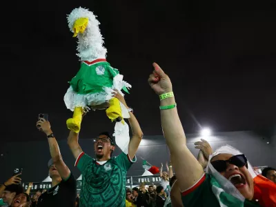 Soccer Football - FIFA World Cup 2026 - Round of 32 - Mexico v Ecuador - Fans gather in Los Angeles - Los Angeles, California, U.S. - June 30, 2026 Mexico fans celebrate at a watch party in Boyle Heights, Los Angeles during the match REUTERS/Lisi Niesner