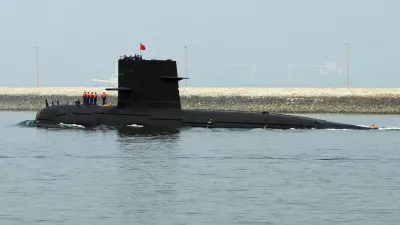 A Chinese navy submarine leaves Qingdao Port, Shandong province April 22, 2009. China will show off its resurgent naval strength this week at a parade marking 60 years since the founding of its navy, presenting its fleet of warships and nuclear submarines as a force for peace, not aggression. REUTERS/Guang Niu/Pool (CHINA POLITICS MILITARY)