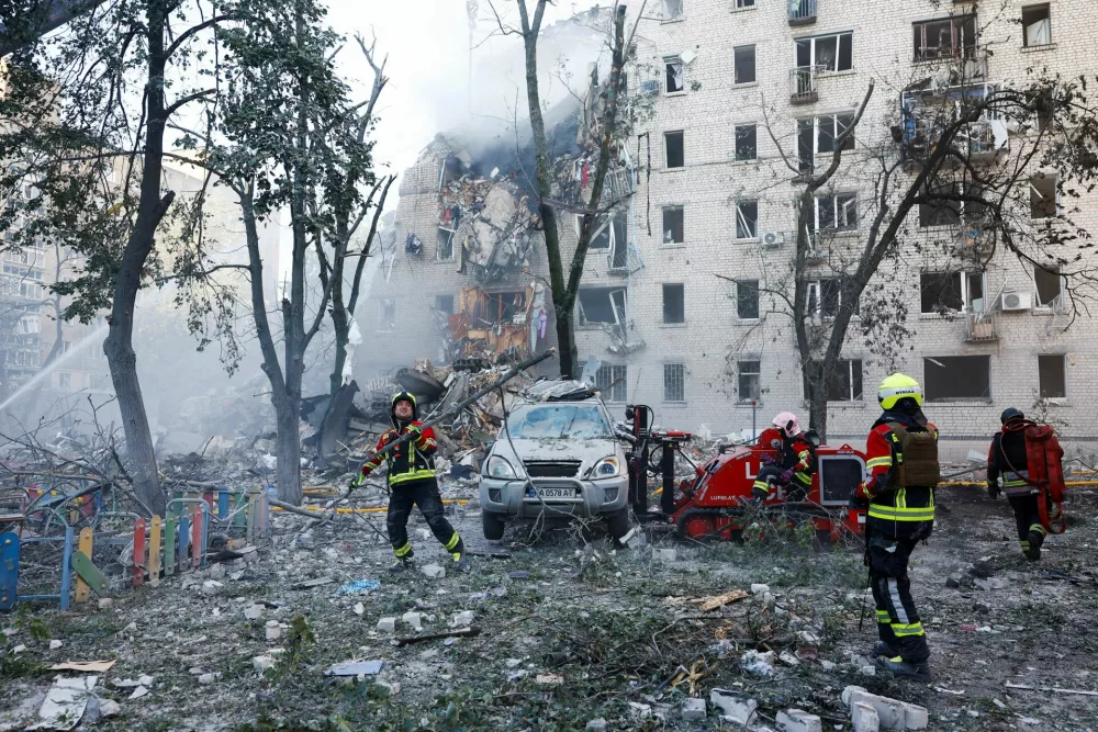 Rescuers work at the site of an apartment building damaged during overnight Russian missile and drone strikes, amid Russia's attack on Ukraine, in Kyiv, Ukraine, July 2, 2026. REUTERS/Valentyn Ogirenko