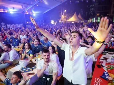 Bosnian national team soccer fans react as they watch a broadcast of the FIFA World Cup round of 32 soccer match between the United States and Bosnia, at a fan zone in Sarajevo, Bosnia, Thursday, July 2, 2026. (AP Photo/Armin Durgut)