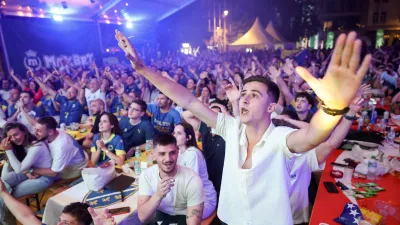 Bosnian national team soccer fans react as they watch a broadcast of the FIFA World Cup round of 32 soccer match between the United States and Bosnia, at a fan zone in Sarajevo, Bosnia, Thursday, July 2, 2026. (AP Photo/Armin Durgut)