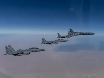 In this Wednesday, Jan. 27, 2021 handout photo, released by the U.S. Air Force, a B-52 bomber from the 2nd Bomb Wing of Barksdale Air Force Base in Louisiana, right, flies with Royal Saudi Air Force F-15s during a mission in the Middle East. The U.S. military said Wednesday it again flew a B-52 bomber over the Middle East "to deter potential aggression" amid tensions with Iran. (U.S. Air Force/Senior Airman Roslyn Ward, via AP)