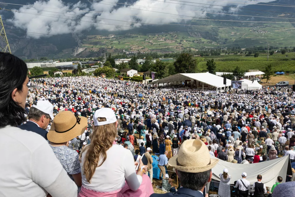 Thousands of worshippers attend a consecration ceremony for four new bishops outside the Society of St. Pius X seminary, in Econe, Switzerland, Wednesday, July 1, 2026. (Cyril Zingaro/Keystone via AP)