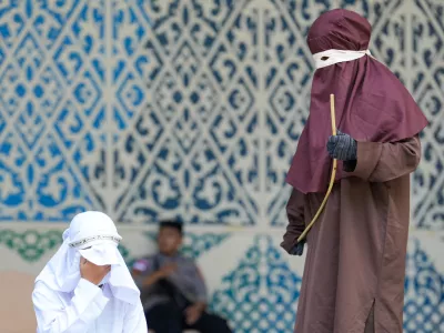 May 21, 2026, Banda Aceh, Aceh, Indonesia: A woman convicted of adultery and adultery was sentenced to 100 lashes in Banda Aceh, Aceh Province, Indonesia, on Thursday. The caning was imposed after she was found guilty of violating Aceh's Sharia law. The public caning served as a lesson and transparency in the implementation of punishment, guaranteed by the Aceh Qanun (Aceh Law), which was passed in 2014. (Credit Image: &copy; Muhammad Iqbal/ZUMA Press Wire)