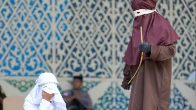 May 21, 2026, Banda Aceh, Aceh, Indonesia: A woman convicted of adultery and adultery was sentenced to 100 lashes in Banda Aceh, Aceh Province, Indonesia, on Thursday. The caning was imposed after she was found guilty of violating Aceh's Sharia law. The public caning served as a lesson and transparency in the implementation of punishment, guaranteed by the Aceh Qanun (Aceh Law), which was passed in 2014. (Credit Image: &copy; Muhammad Iqbal/ZUMA Press Wire)