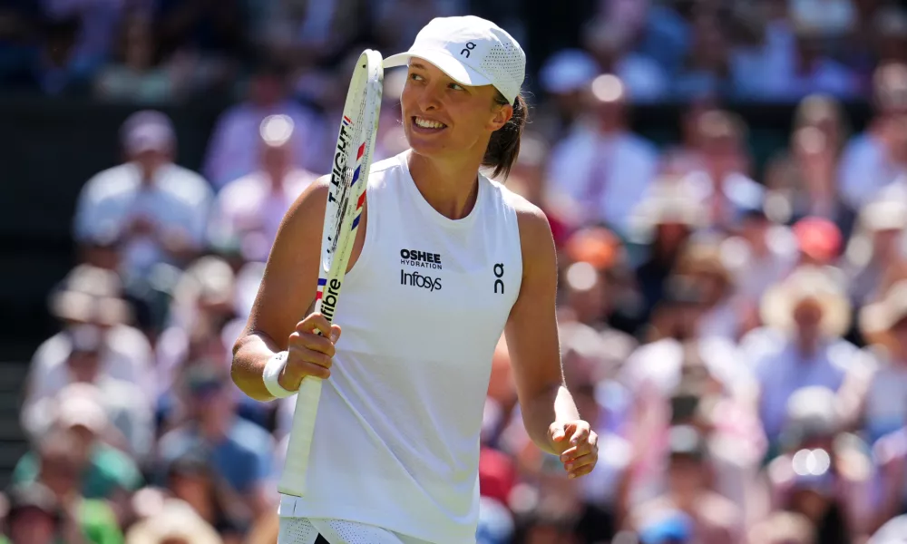 Iga Swiatek of Poland celebrates winning the second round women's singles match against Karolina Pliskova of the Czech Republic at the Wimbledon Tennis Championships in London, Thursday, July 2, 2026.(AP Photo/Kirsty Wigglesworth)